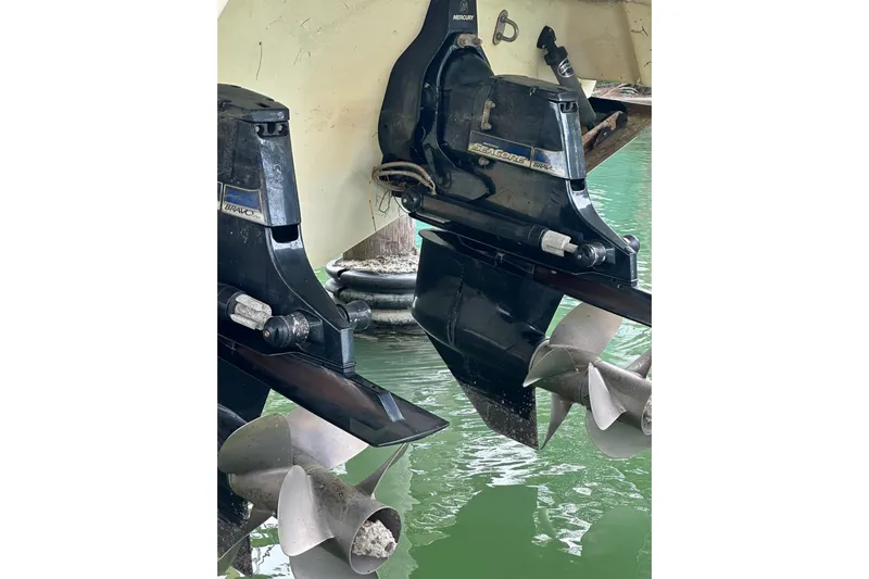 Oceanholic Yacht Photos Pics 2018 Formula 330 Crossover Bowrider outboard motors in water, showcasing propellers.