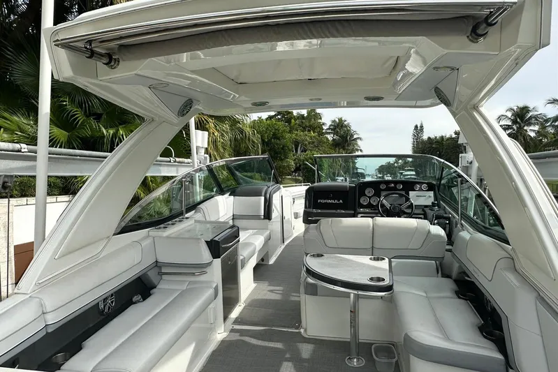 Oceanholic Yacht Photos Pics 2018 Formula 330 Crossover Bowrider interior with luxurious seating and modern dashboard.