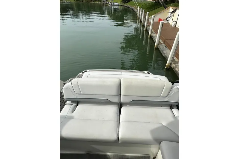 Oceanholic Yacht Photos Pics 2018 Formula 330 Crossover Bowrider, rear seating view by the dock.