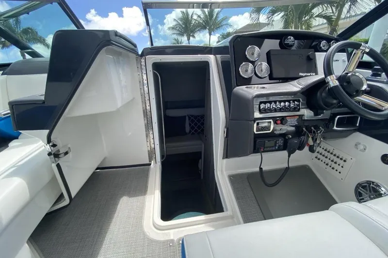 Oceanholic Yacht Photos Pics 2018 Formula 330 Crossover Bowrider cockpit with modern controls and sleek design.