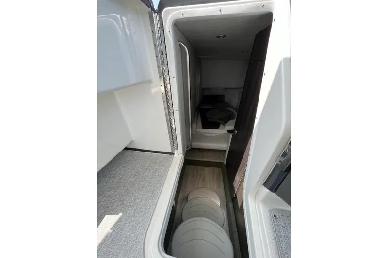 Oceanholic Yacht Photos Pics 2018 Formula 330 Crossover Bowrider cabin interior with modern design and storage space.