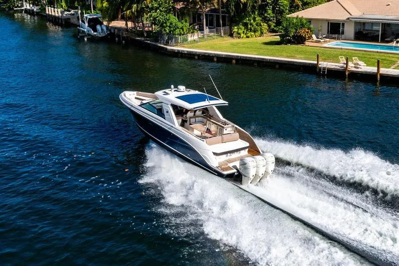 Sobe III Yacht Photos Pics 2019 Sea Ray SLX 400 Outboard cruising on a scenic waterway near waterfront homes.