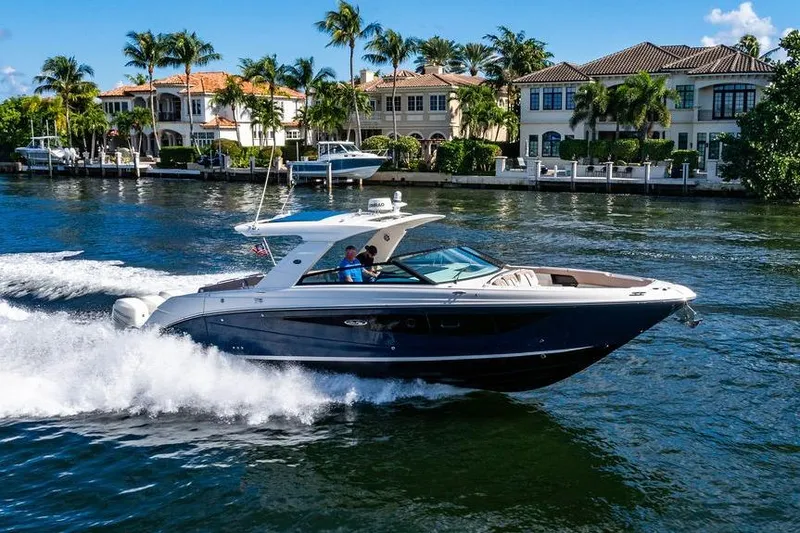 Sobe III Yacht Photos Pics 2019 Sea Ray SLX 400 Outboard cruising on a scenic waterway with luxury homes.