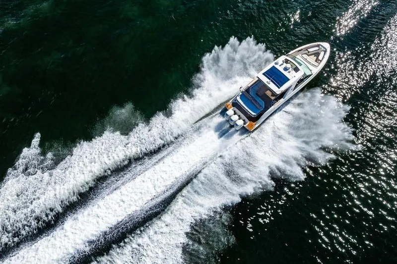 Sobe III Yacht Photos Pics 2019 Sea Ray SLX 400 Outboard cruising on open water, creating dynamic wake patterns.