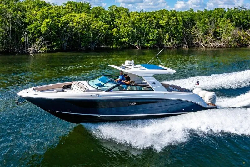 Sobe III Yacht Photos Pics 2019 Sea Ray SLX 400 Outboard cruising on a scenic waterway with lush greenery.