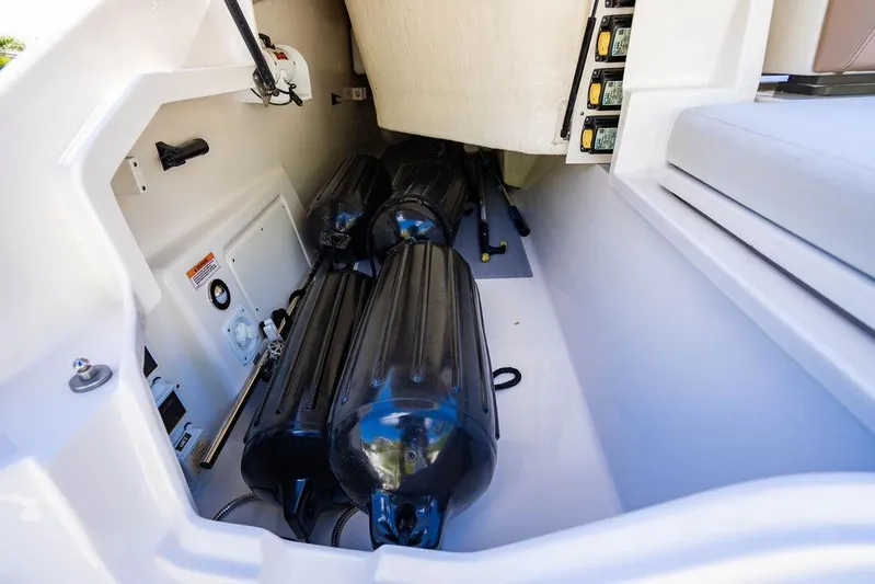 Sobe III Yacht Photos Pics Storage compartment of 2019 Sea Ray SLX 400 Outboard with fenders and equipment.