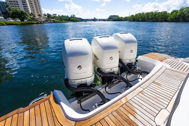 Sobe III Yacht Photos Pics 2019 Sea Ray SLX 400 Outboard with triple engines on a sunny waterway.