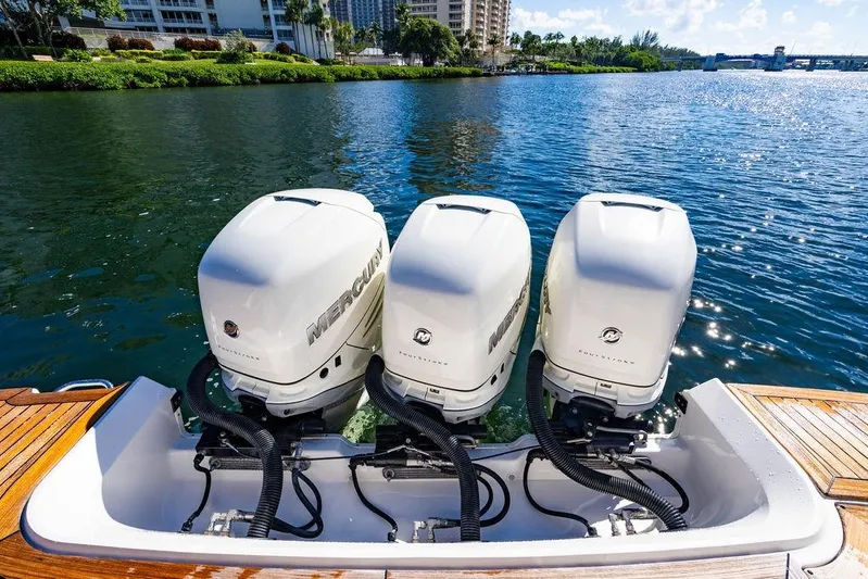 Sobe III Yacht Photos Pics 2019 Sea Ray SLX 400 Outboard with triple Mercury engines on a sunny waterway.