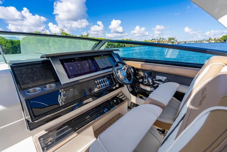 Sobe III Yacht Photos Pics Luxurious 2019 Sea Ray SLX 400 Outboard helm with modern controls and scenic water view.