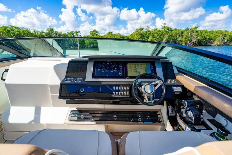 Sobe III Yacht Photos Pics 2019 Sea Ray SLX 400 Outboard helm with modern controls and scenic water view.