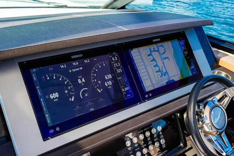 Sobe III Yacht Photos Pics 2019 Sea Ray SLX 400 Outboard dashboard with dual Simrad displays and steering wheel.