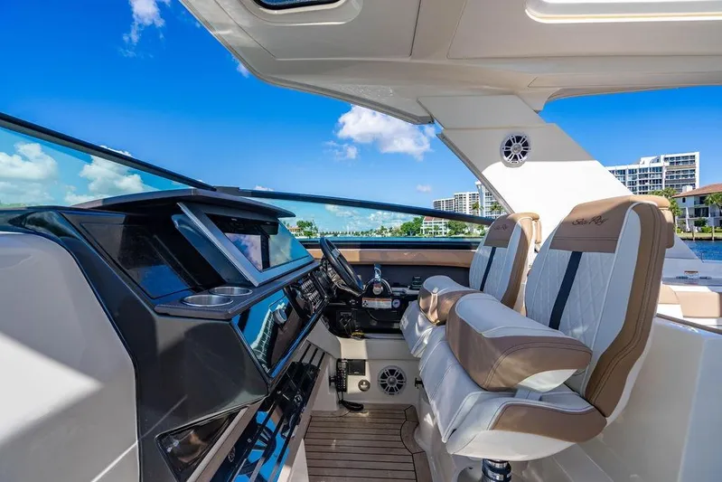 Sobe III Yacht Photos Pics 2019 Sea Ray SLX 400 Outboard cockpit with luxurious seating and modern controls.