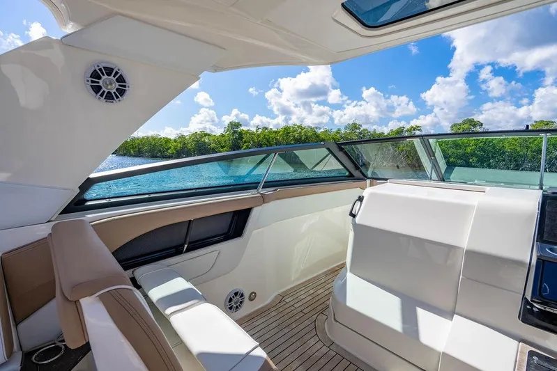 Sobe III Yacht Photos Pics Interior view of 2019 Sea Ray SLX 400 Outboard boat with scenic water backdrop.