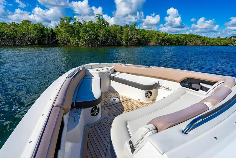 Sobe III Yacht Photos Pics 2019 Sea Ray SLX 400 Outboard boat interior with luxurious seating, on a sunny day.