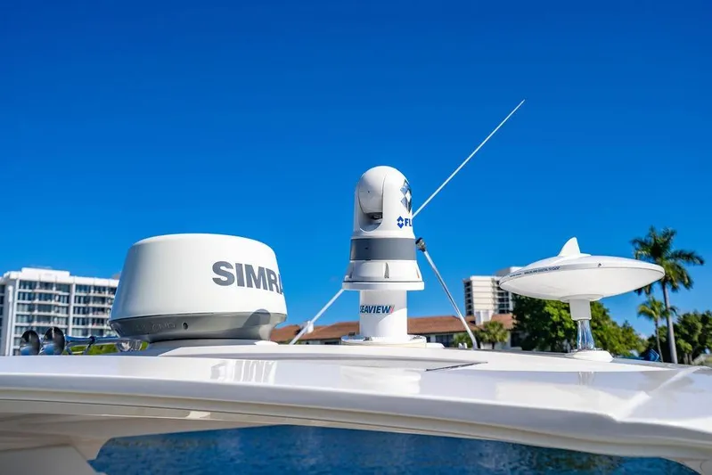 Sobe III Yacht Photos Pics 2019 Sea Ray SLX 400 Outboard with advanced navigation equipment under clear blue sky.