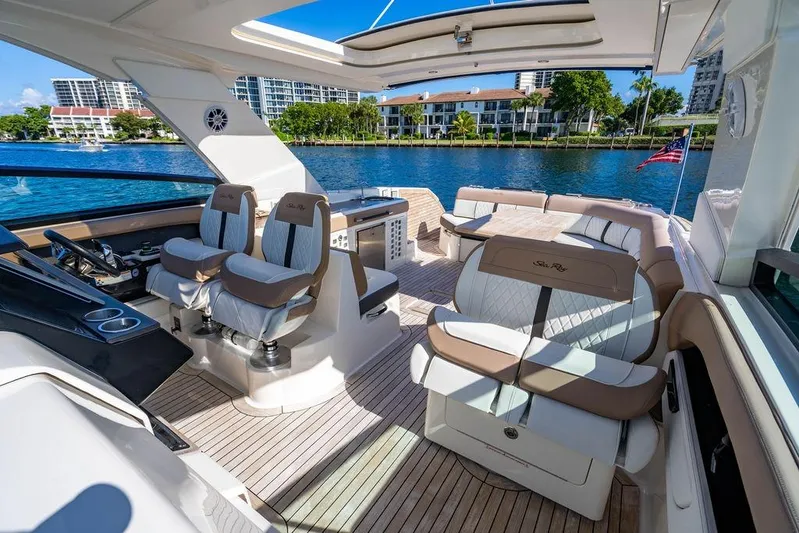 Sobe III Yacht Photos Pics 2019 Sea Ray SLX 400 Outboard luxury boat interior with plush seating and scenic waterfront view.