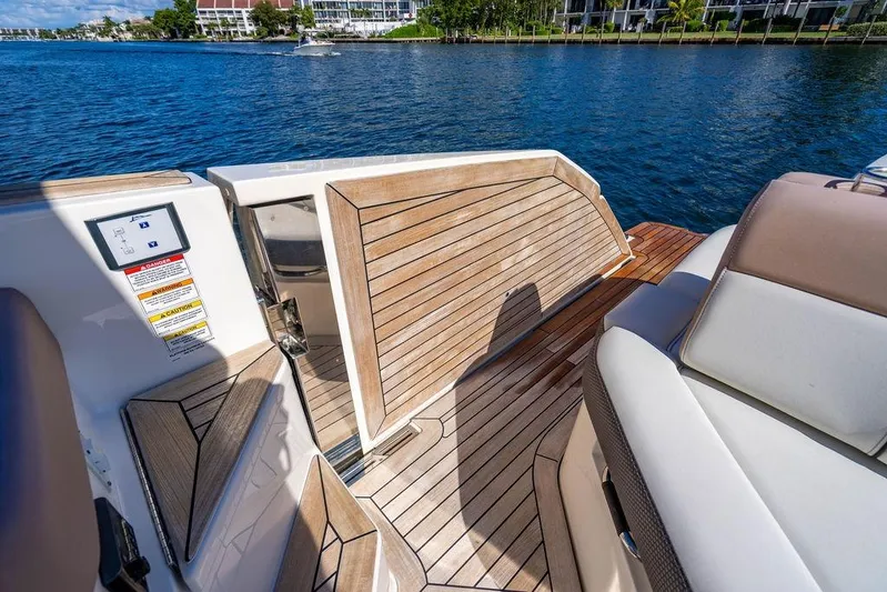 Sobe III Yacht Photos Pics 2019 Sea Ray SLX 400 Outboard boat interior with teak flooring and luxurious seating.