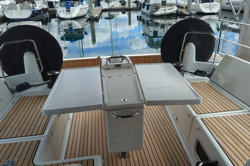 Her Intentions Yacht Photos Pics Cockpit of 2021 Jeanneau Sun Odyssey 440 yacht with teak flooring and foldable table.
