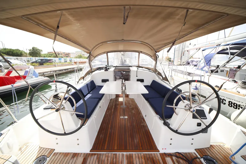 Twenty One Cent Yacht Photos Pics 2022 Jeanneau Sun Odyssey 380 yacht cockpit with dual steering wheels and seating.