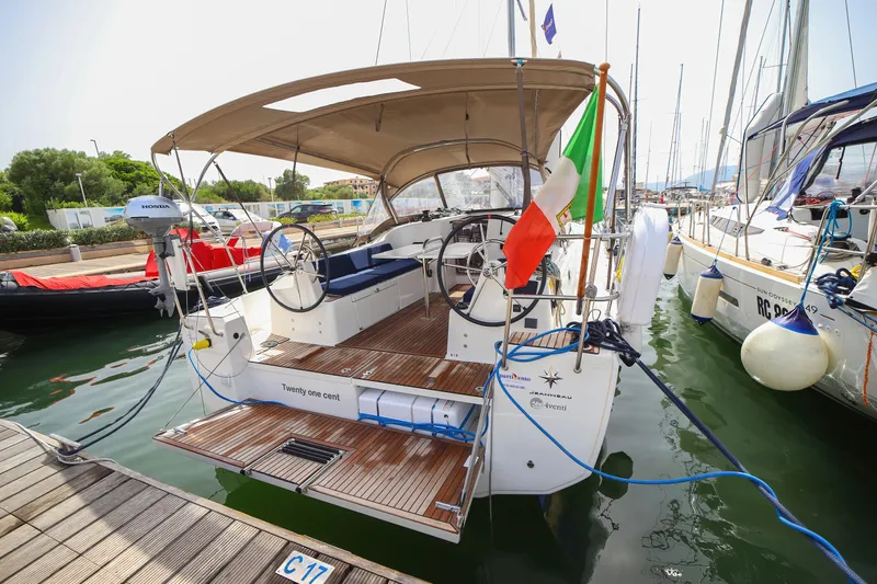 Twenty One Cent Yacht Photos Pics Jeanneau Sun Odyssey 380 sailboat, 2022 model, docked with Italian flag and Honda motor.