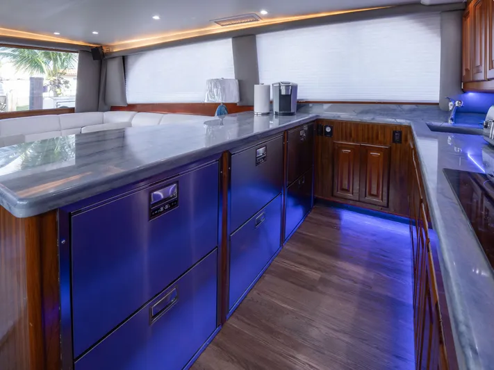 Samurai Yacht Photos Pics Luxurious kitchen interior of a 1998 Viking 58 Convertible yacht with modern appliances.