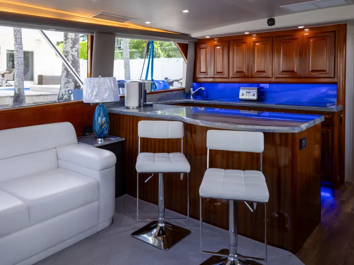 Samurai Yacht Photos Pics Luxurious interior of a 1998 Viking 58 Convertible yacht with modern seating and elegant wood finishes.