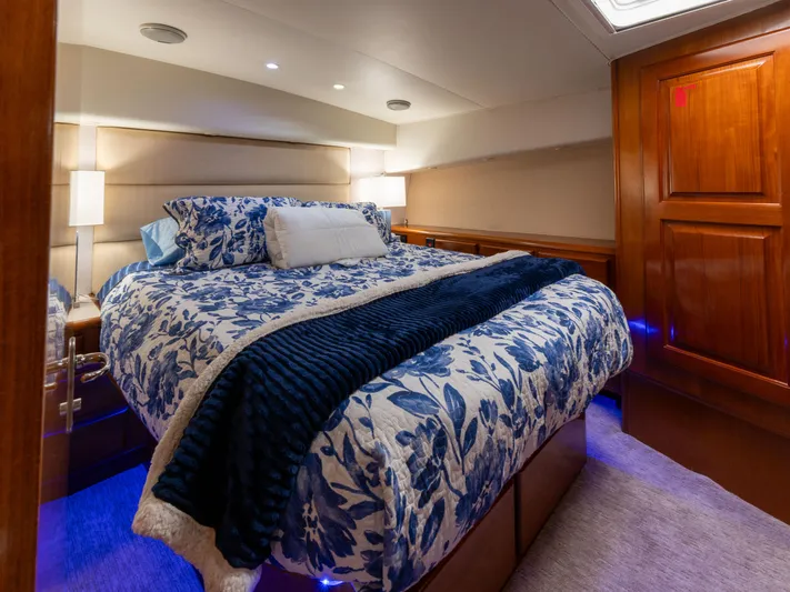 Samurai Yacht Photos Pics Luxurious bedroom interior of 1998 Viking 58 Convertible yacht with floral bedding.