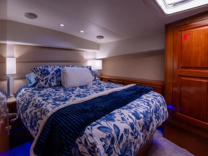 Samurai Yacht Photos Pics Luxurious bedroom interior of 1998 Viking 58 Convertible yacht with floral bedding.