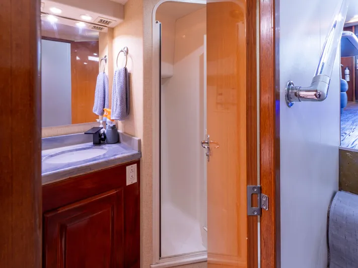 Samurai Yacht Photos Pics Bathroom interior of 1998 Viking 58 Convertible yacht with shower and vanity.