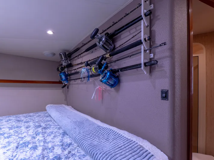 Samurai Yacht Photos Pics Fishing rods mounted on wall in 1998 Viking 58 Convertible yacht cabin.