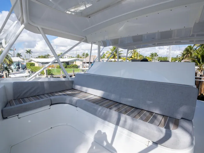 Samurai Yacht Photos Pics Spacious seating area on 1998 Viking 58 Convertible yacht, featuring comfortable cushions and scenic views.