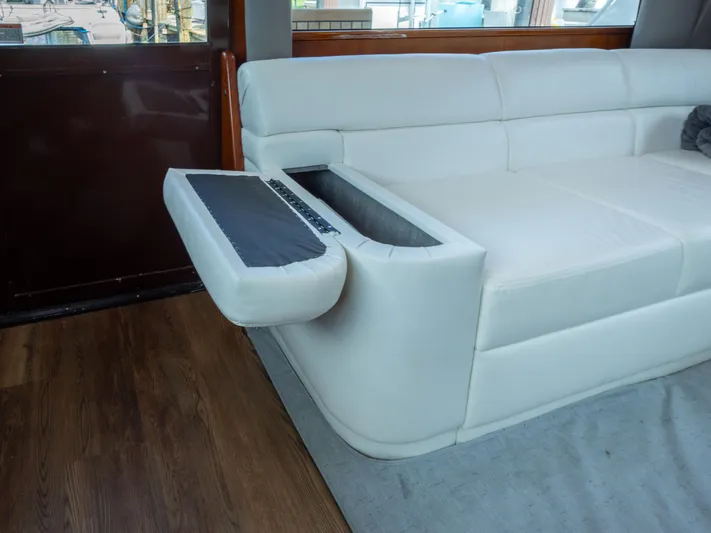 Samurai Yacht Photos Pics White leather sofa with built-in storage on a 1998 Viking 58 Convertible yacht.