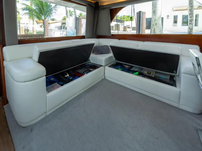 Samurai Yacht Photos Pics Luxurious interior of 1998 Viking 58 Convertible yacht with white leather seating and storage.