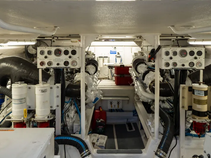 Samurai Yacht Photos Pics Engine room of 1998 Viking 58 Convertible yacht, showcasing machinery and control panels.