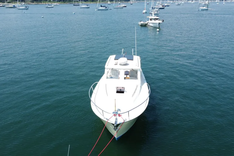 Tango Yacht Photos Pics 2006 MJM 34z Downeast boat anchored in a serene harbor.
