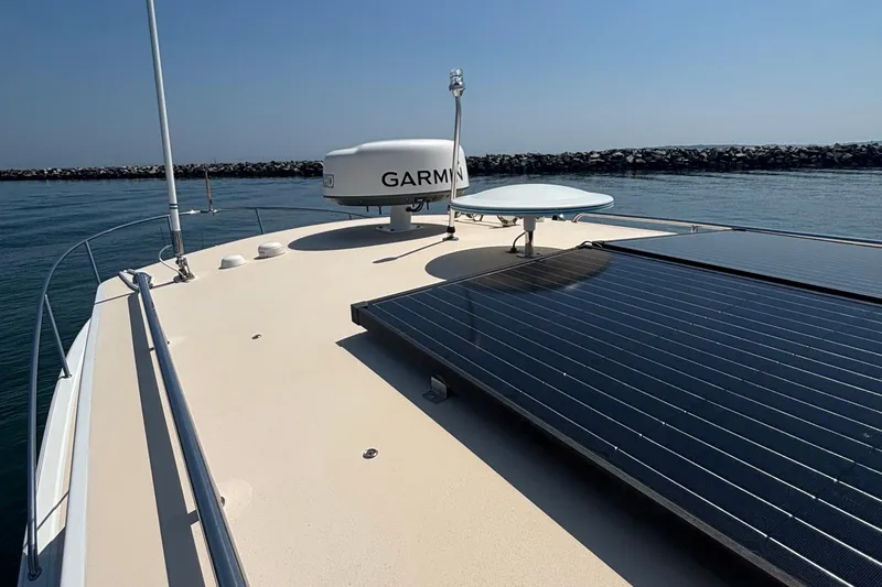 Tango Yacht Photos Pics 2006 MJM 34z Downeast boat deck with solar panels and Garmin radar.