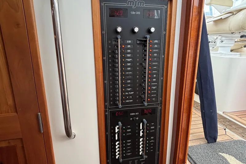 Tango Yacht Photos Pics Control panel of a 2006 MJM 34z Downeast boat, featuring switches and indicators.