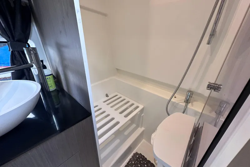  Yacht Photos Pics 2024 Beneteau Flyer 10 bathroom with modern sink and shower.