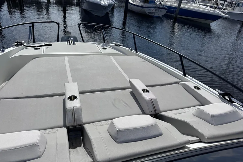  Yacht Photos Pics 2024 Beneteau Flyer 10 boat with spacious sunbathing deck at marina.