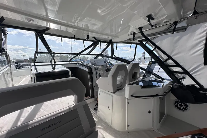  Yacht Photos Pics 2024 Beneteau Flyer 10 cockpit with modern helm and seating under a sunny sky.