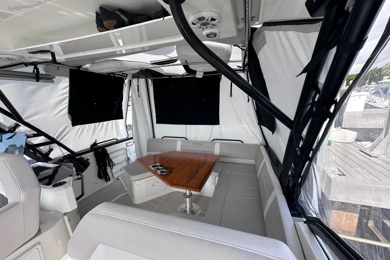 Yacht Photos Pics 2024 Beneteau Flyer 10 interior with seating and table, featuring modern design and comfort.
