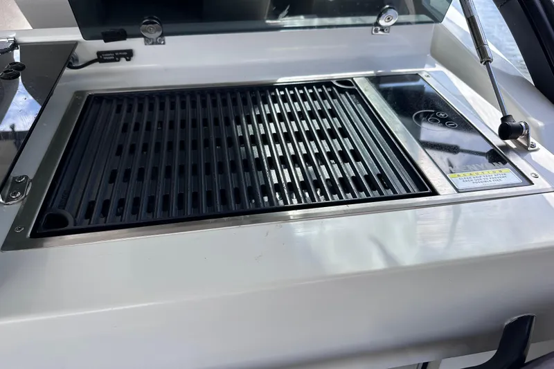  Yacht Photos Pics Outdoor grill on 2024 Beneteau Flyer 10 boat, featuring sleek design and modern controls.