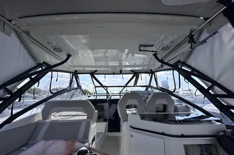  Yacht Photos Pics Interior view of 2024 Beneteau Flyer 10 boat, featuring modern seating and sleek design.