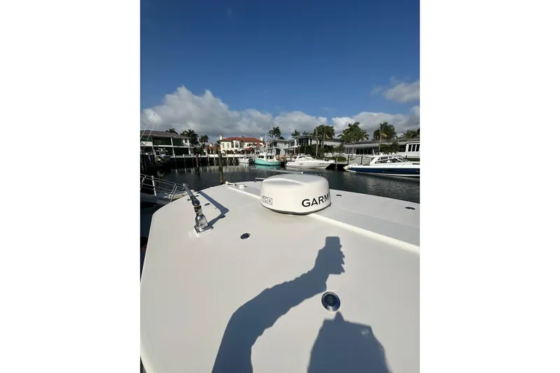  Yacht Photos Pics 2017 Regulator 28 boat with Garmin radar, docked in a scenic marina.