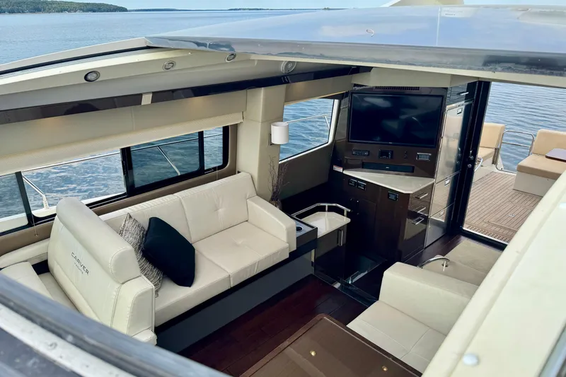Orion Yacht Photos Pics Luxurious interior of 2018 Carver C52 Coupe yacht with elegant seating and modern amenities.