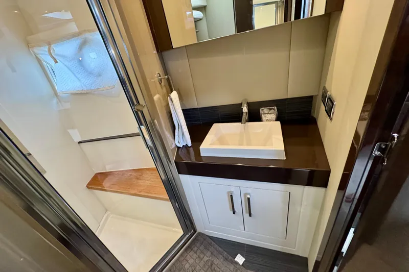 Orion Yacht Photos Pics Luxurious bathroom in 2018 Carver C52 Coupe yacht with modern sink and shower.