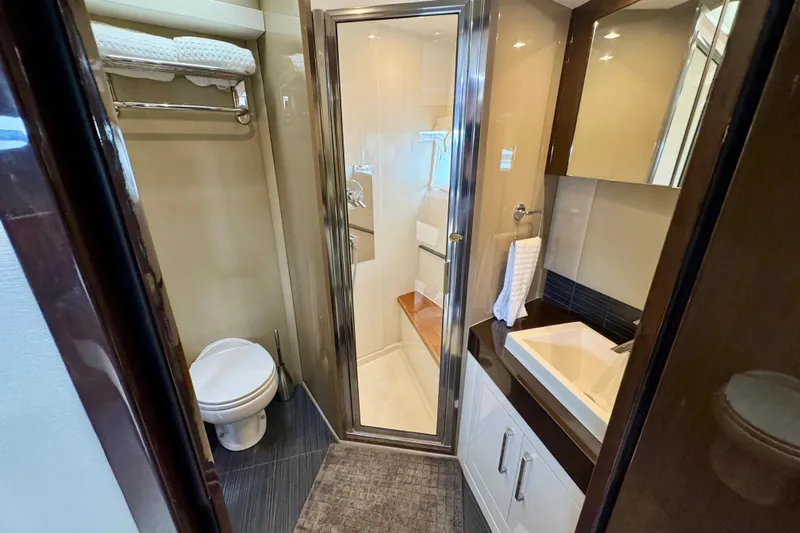 Orion Yacht Photos Pics Luxurious bathroom in 2018 Carver C52 Coupe yacht with modern fixtures and elegant design.