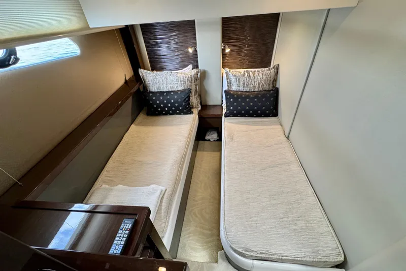 Orion Yacht Photos Pics 2018 Carver C52 Coupe interior with twin beds and elegant decor.