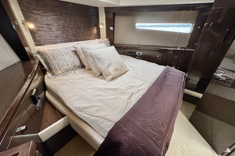 Orion Yacht Photos Pics Luxurious bedroom interior of 2018 Carver C52 Coupe yacht with elegant bedding.