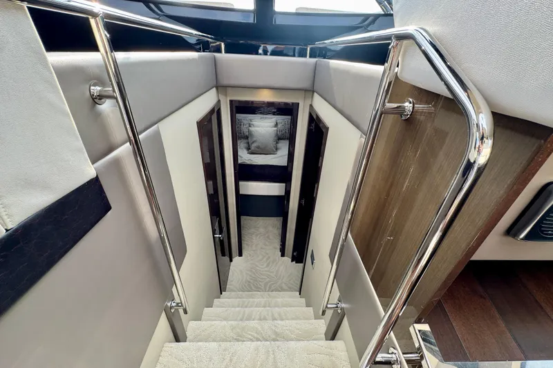 Orion Yacht Photos Pics Staircase in 2018 Carver C52 Coupe yacht interior with modern design and chrome railings.